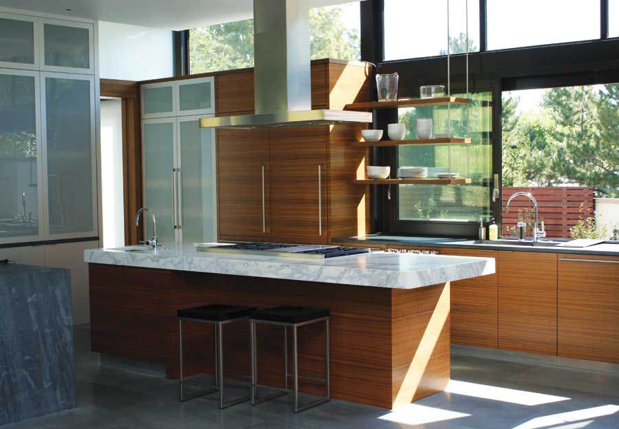
Architect E.J. Meade designs homes with high windows to bounce light deep into interiors.
